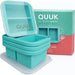 QUUK set of four compact two-compartment silicone freezer trays with clear lids and branded packaging.